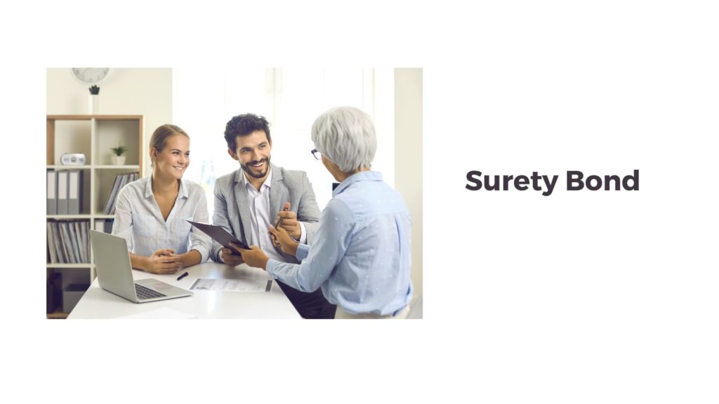 Surety Bond - Surety agent is talking to a business couple about the bond they need in a table.